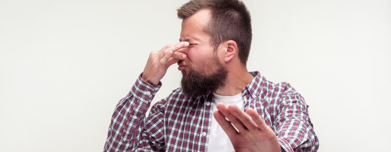 attachment-portrait-of-confused-bearded-man-showing-stop-gesture-and-pinching-picture-id1194574025-min