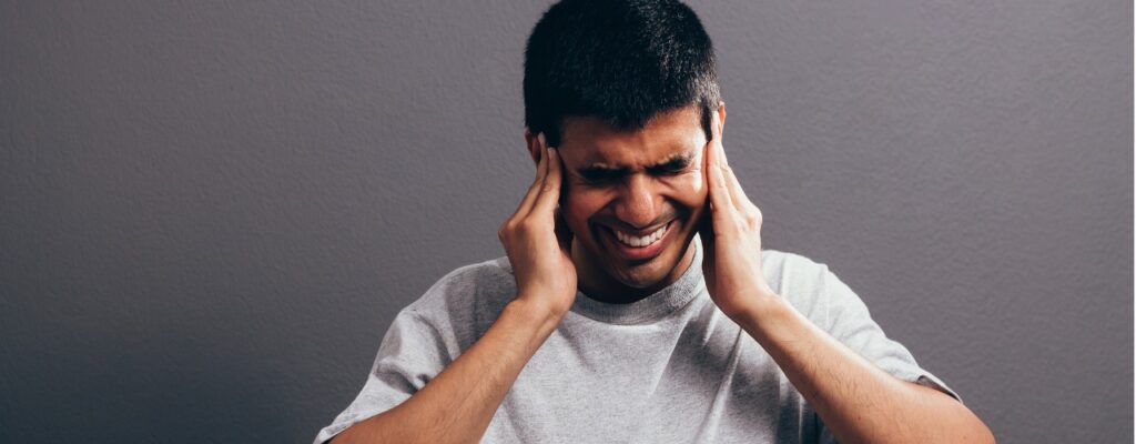 attachment-sore-ear-ear-ache-concept-the-sad-crying-man-with-headache-or-pain-picture-id1073141900